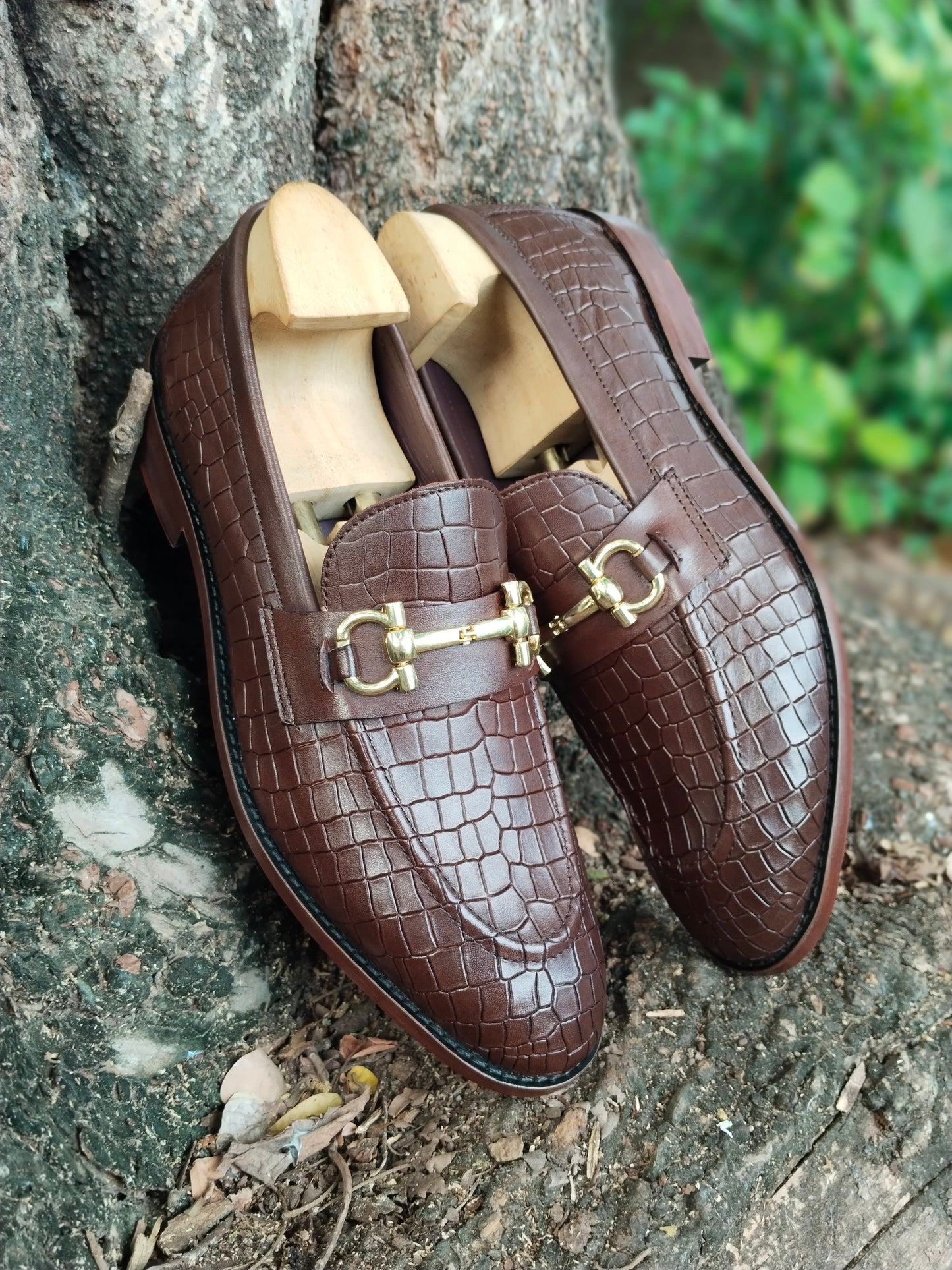 BROWN SLIP ON IN CROCODILE  PRINT AND BUCKLE