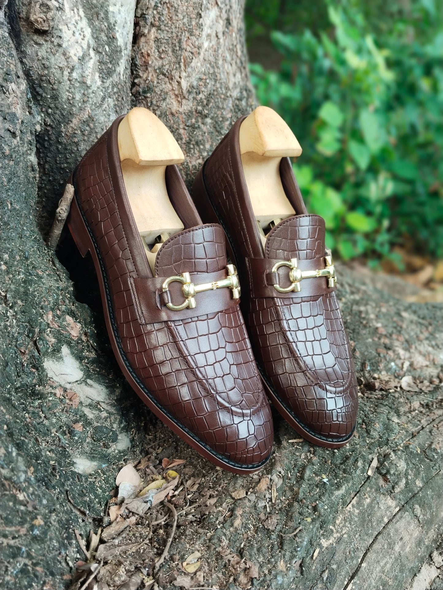 BROWN SLIP ON IN CROCODILE  PRINT AND BUCKLE