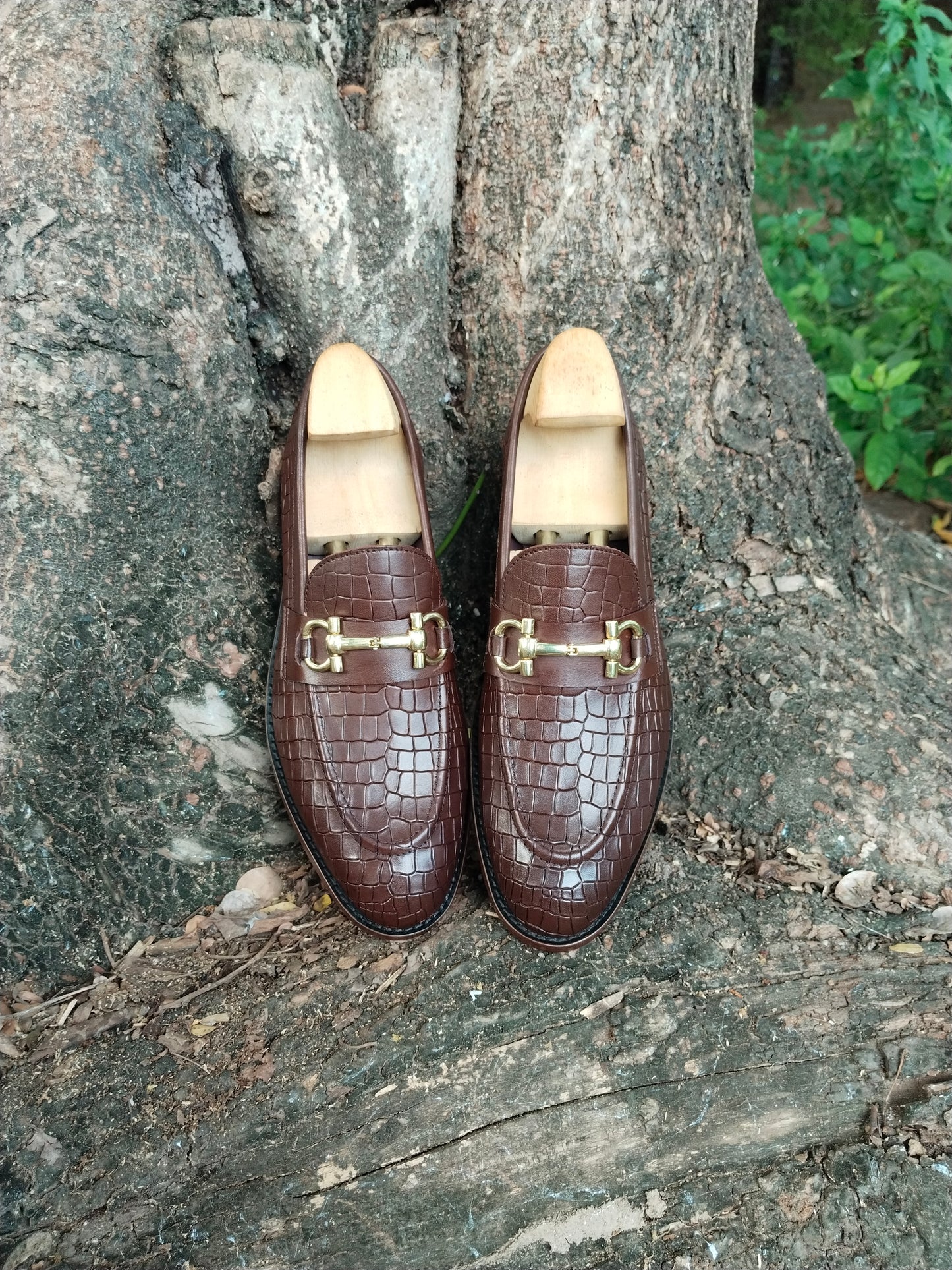 BROWN SLIP ON IN CROCODILE  PRINT AND BUCKLE