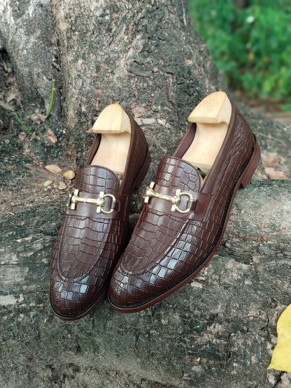 BROWN SLIP ON IN CROCODILE  PRINT AND BUCKLE