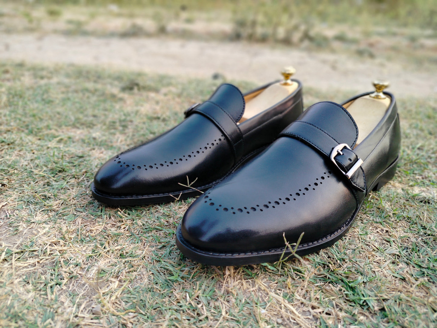 Black Slip Ons With Single Strap in Leather Sole