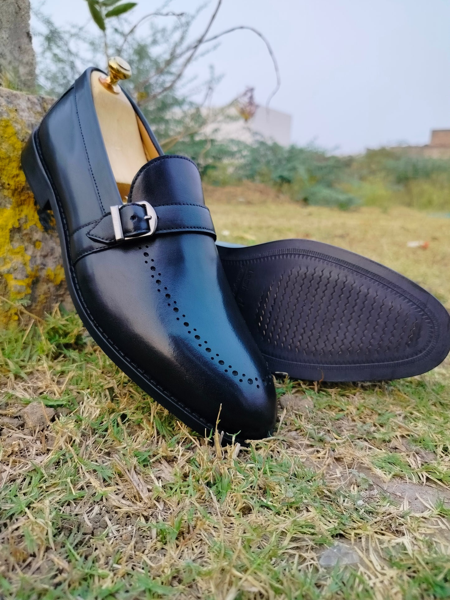 Black Slip Ons With Single Strap in Leather Sole