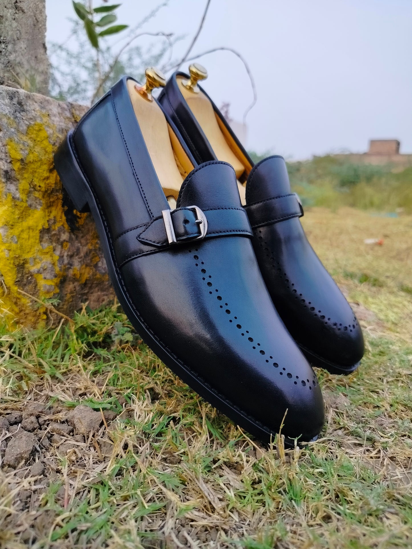 Black Slip Ons With Single Strap in Leather Sole