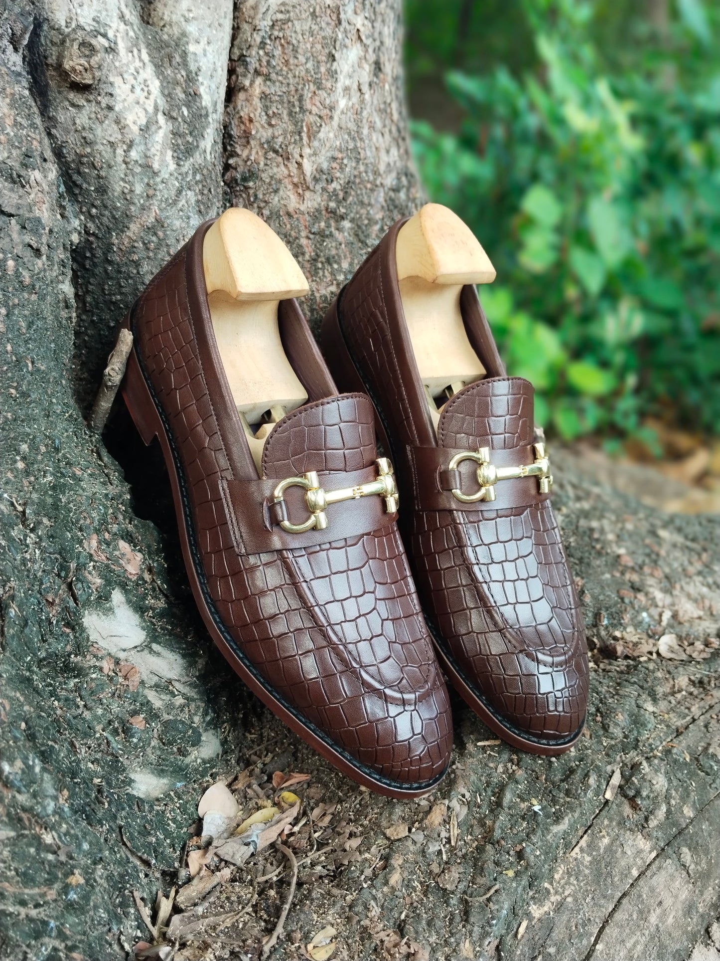 BROWN SLIP ON IN CROCODILE  PRINT AND BUCKLE